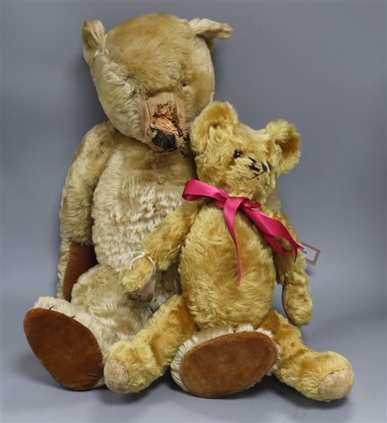 A large golden mohair straw-filled teddy bear, possibly by J. K. Farnell (damage and repairs) and a smaller bear with growler